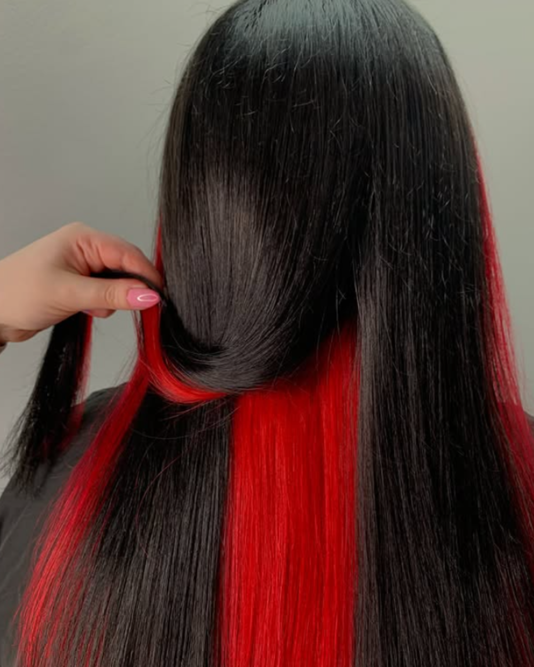 hidden red hair colour underneath a black hair colour on long layered ladies hair hidden red hair colour underneath a black hair colour on long layered ladies hair