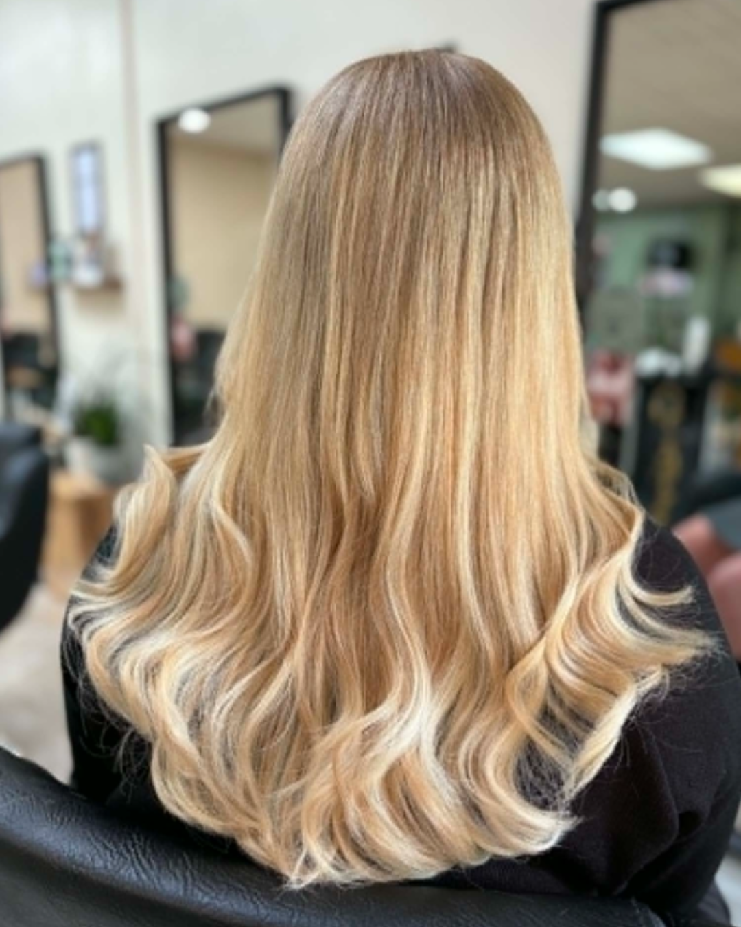long, blonde professionally fitted tape hair extensions at melanie richards salon peterborough